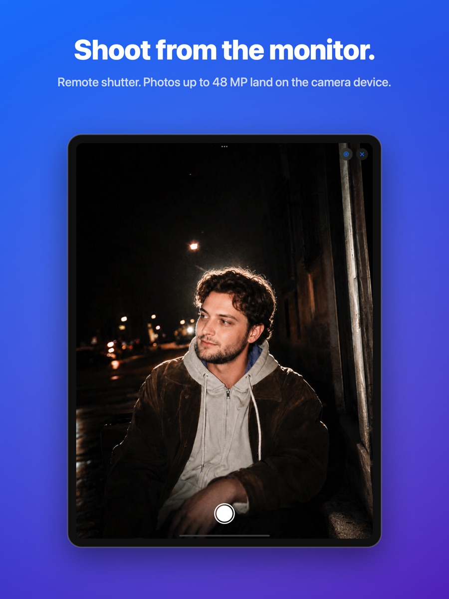 Monitor role on iPad: full-screen live feed with the remote shutter button